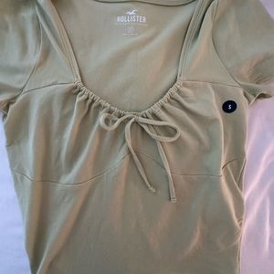 Green Hollister baby tee